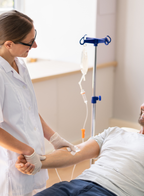 man getting IV treatment